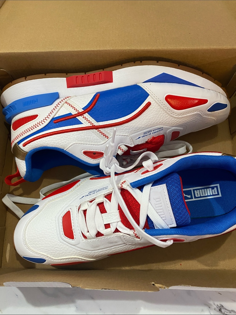 Puma women’s red white and blue